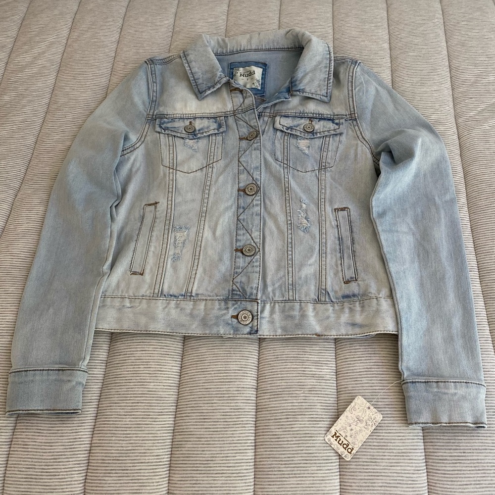 Light wash distressed denim jacket